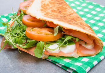 typical piadina romagnola with ham, cheese and rocket - 358036195