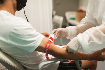 Taking blood samples from football players, coronavirus test Sars-CoV-2