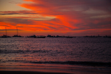 Naklejka na ściany i meble Sunset sky clouds on the beach. Texture