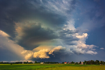 Obraz na płótnie Canvas Supercell storm clouds with wall cloud and intense rain