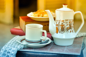 cup of tea and teapot on the table