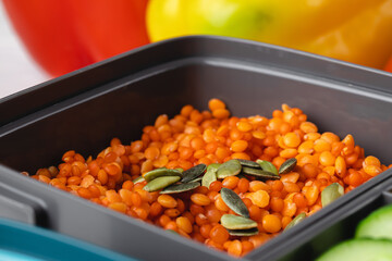Close up photo of plastic lunch box with cooked food