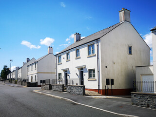 A new housing development with semi-detached houses in a diminishing perspective - UK