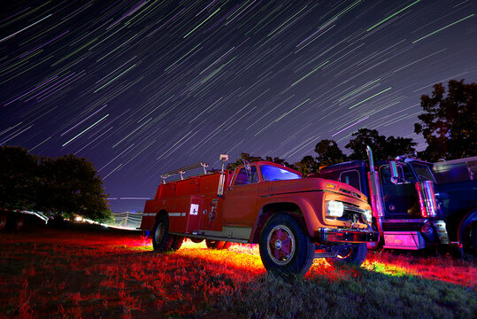 vintage truck at night with light painting and star trails