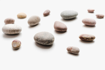 sea ​​stones on white background, background of stones, 
sea ​​stones, 