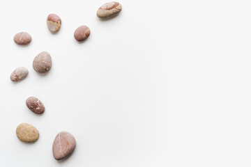 sea ​​stones on white background, background of stones, 
sea ​​stones, 
