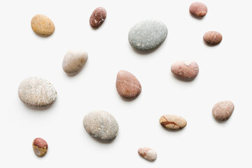 sea ​​stones on white background, background of stones, 
sea ​​stones, 