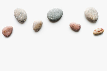 Fototapeta na wymiar sea ​​stones on white background, background of stones, sea ​​stones, 