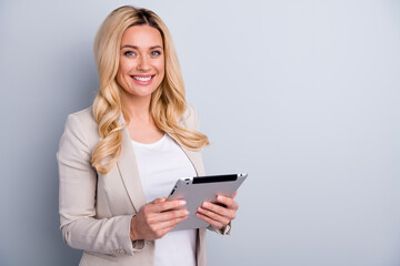 Close-up portrait of her she nice attractive charming skilled cheerful wavy-haired lady holding in hands using tablet finance hr it market research isolated on light white gray pastel color background