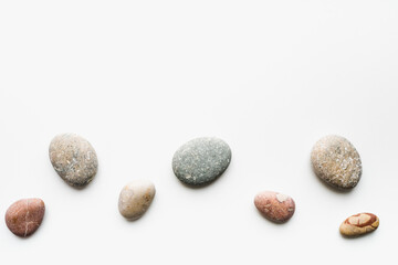 sea ​​stones on white background, background of stones, 
sea ​​stones, 