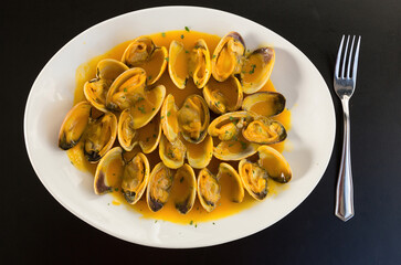 Clams cooked in sauce