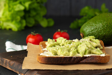Fried toast with cream cheese and avocado slices