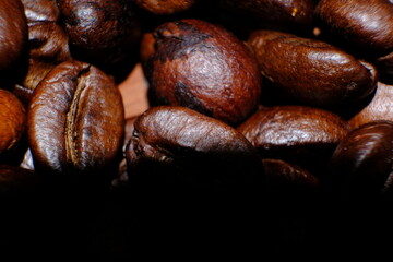 coffee beans on wood table and macro coffee beans background