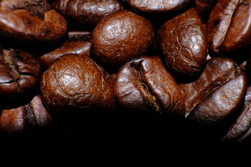 coffee beans on wood table and macro coffee beans background