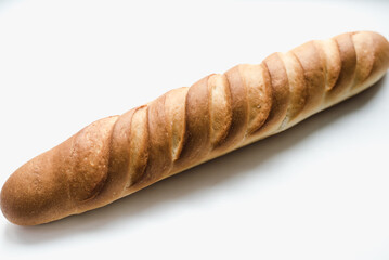 baguette on a white background, sliced ​​long loaf, sliced ​​long loaf on a white...