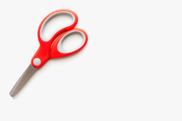 stationery scissors on a white background, scissors with red handle, scissors with plastic handle on a white background