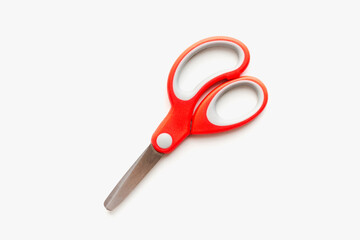 stationery scissors on a white background, scissors with red handle, scissors with plastic handle on a white background