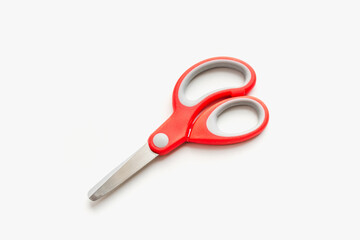 stationery scissors on a white background, scissors with red handle, scissors with plastic handle on a white background