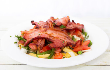 Salad with bacon front view close up