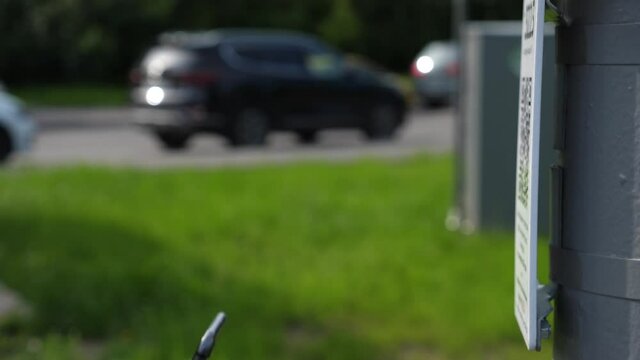 QR code cashless payment. Scan to pay system. Business or technology concept : young man using smartphone for scanning QR code for paying in the cafeteria
