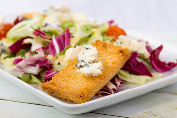 Salad with blue cheese close up