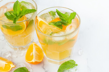 tea with lemon mint and ice on a white background.