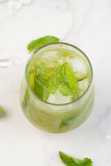 green drink with ice and mint.
