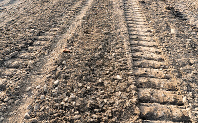 Track on open field way. Track of tank tracks on the ground.