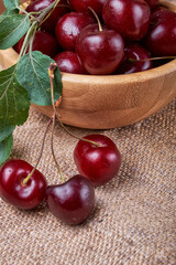 Fresh cherries in a bowl on the table