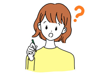ペンを持ち疑問に思う若い女性