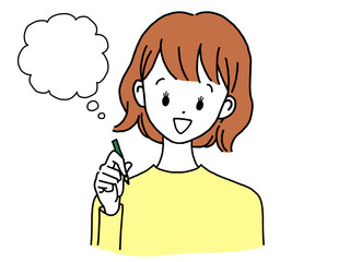 ペンを持ち考える若い女性