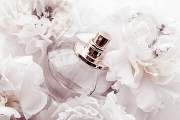 Chic fragrance bottle as luxe perfume product on background of peony flowers, parfum ad and beauty...