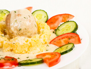 Natural turkey meatball with mashed potatoes and vegitables side view close up
