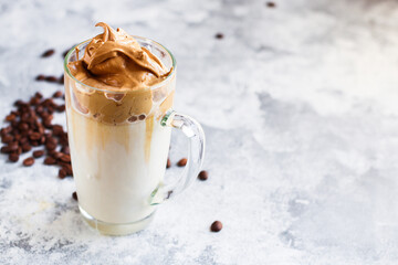 Dalgona coffee ice drink
cappuccino or latte fluffy creamy whipped  food background top view copy space