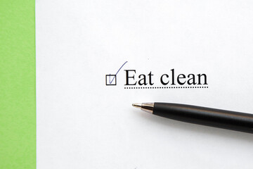 a piece of paper with the inscription eat clean from to do list with a tick 