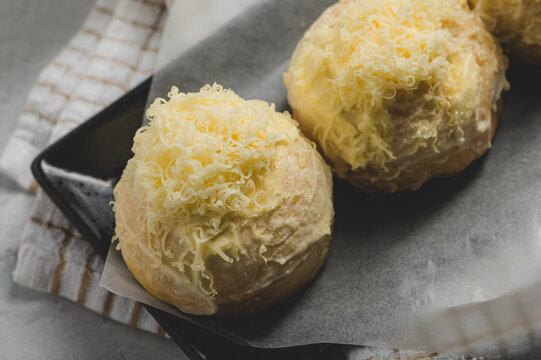 Buttery and Cheesy Ensaymada ( Bun topped with Butter Sugar and Cheese) - Filipino Bread Snack- Top View