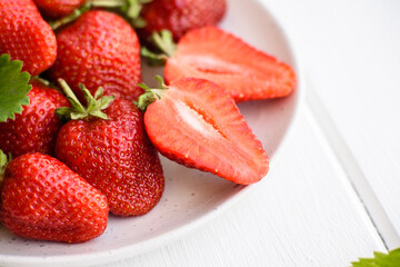 Beautiful juicy fresh strawberries on the concrete surface of the table
