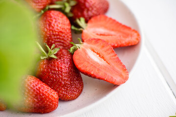 Beautiful juicy fresh strawberries on the concrete surface of the table
