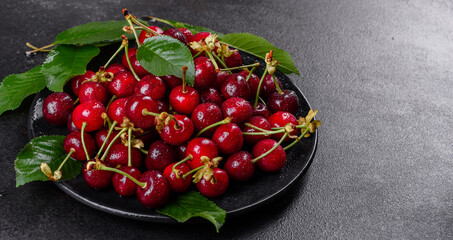 Fresh delicious red bright cherry berries torn in the summer garden