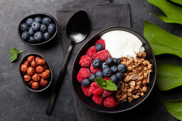 Healthy breakfast with granola, yogurt and berries