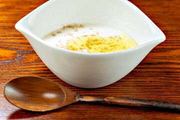 Homemade soft tofu made from soya milk, topped with rock soil and olive oil