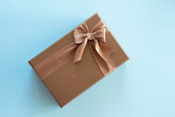 a gold color gift box on blue background