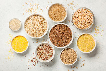 Set with various cereal grains on stone background