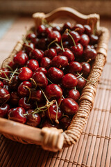 Cherries. Cherry. Cherries in wood bowl. Red cherry. Fresh cherries. Cherry on background. healthy food concept.
