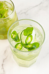 drink with green chili, cucumber and ice.