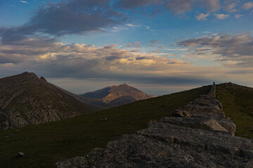 Naklejka premium Late evening sunlight catching Slieve Binnian, Mourne Mountains, County Down, Northern Ireland, Mourne Area of Outstanding Natural Beauty