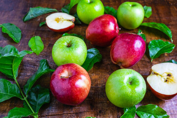.Fresh fruit, green apple and red apple on a wooden background