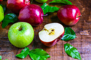 .Fresh fruit, green apple and red apple on a wooden background