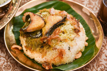 Fish biryani. Spicy and delicious Malabar biryani or Hydrabadi  biryani, Dum Biriyani,  pulao basmati rice, herbs, raitha for Ramadan Kareem, Eid