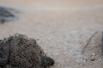 Fishing nets on dock port. Fish traps cast on the sandy beach